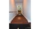 Staircase leading down to a lower level showcasing hardwood steps and painted risers at 3136 Blueberry Dr, Monroe, NC 28110