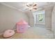 Bright bedroom features a window seat and a pink play tent at 3284 Millstone Creek Rd, Lancaster, SC 29720