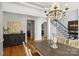 Open-concept dining room with hardwood floors and staircase view at 3284 Millstone Creek Rd, Lancaster, SC 29720