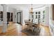 Bright dining room with hardwood floors, large windows, and a stylish chandelier at 3284 Millstone Creek Rd, Lancaster, SC 29720