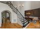 Open foyer with hardwood floors, grand staircase, and adjacent dining room at 3284 Millstone Creek Rd, Lancaster, SC 29720