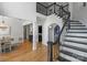 Bright foyer with grand staircase and views into adjacent dining and living spaces at 3284 Millstone Creek Rd, Lancaster, SC 29720