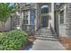 Elegant covered front entry with stone steps and decorative glass door at 3284 Millstone Creek Rd, Lancaster, SC 29720