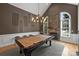 Game room featuring pool table, stone fireplace, and custom millwork at 3284 Millstone Creek Rd, Lancaster, SC 29720