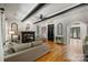 Comfortable living room with dark wood beams, a fireplace, and natural light at 3284 Millstone Creek Rd, Lancaster, SC 29720