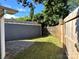 Fenced backyard featuring stone patio and detached garage at 339 Mayflower Ave, Cramerton, NC 28032