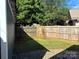 Backyard with wooden fence and stone patio at 339 Mayflower Ave, Cramerton, NC 28032
