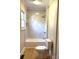 Bathroom features a tiled tub and shower with a toilet at 339 Mayflower Ave, Cramerton, NC 28032