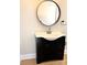 Bathroom features a modern vanity with a round mirror at 339 Mayflower Ave, Cramerton, NC 28032