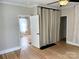 Bedroom with hardwood floors and view into closet at 339 Mayflower Ave, Cramerton, NC 28032