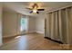 A view of the bedroom highlights hardwood flooring, light walls, and natural lighting at 339 Mayflower Ave, Cramerton, NC 28032