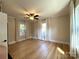 Bedroom featuring hardwood floors, bright windows, and ceiling fan at 339 Mayflower Ave, Cramerton, NC 28032