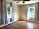 Bedroom with hardwood floors, two windows, and a ceiling fan at 339 Mayflower Ave, Cramerton, NC 28032