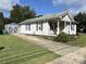 Charming home with a covered porch, well-maintained lawn, and detached garage at 339 Mayflower Ave, Cramerton, NC 28032