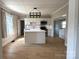 Modern kitchen with center island, stainless steel appliances, and bright lighting at 339 Mayflower Ave, Cramerton, NC 28032