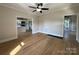Open living room showcasing hardwood floors and view into renovated kitchen at 339 Mayflower Ave, Cramerton, NC 28032