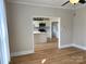 Open-concept living room showing entry to a modern kitchen, perfect for entertaining at 339 Mayflower Ave, Cramerton, NC 28032