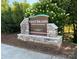 Goat Island Park & Greenway sign featuring stone accents and surrounded by lush greenery at 339 Mayflower Ave, Cramerton, NC 28032