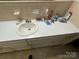 Bathroom sink and countertop needing cleaning at 34393 Springdale Dr, New London, NC 28127