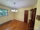 Sunny dining room with hardwood floors, chandelier lighting, and a classic feel at 34393 Springdale Dr, New London, NC 28127
