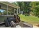 Backyard with outdoor dining area, grill, and shed that offers ample storage and complements the lush greenery at 3701 Methodist Church Ln, Waxhaw, NC 28173