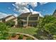 Spacious backyard with a screened porch, patio area, lush greenery, and mature trees creating a private retreat at 3701 Methodist Church Ln, Waxhaw, NC 28173