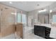 Beautiful bathroom featuring glass shower, bathtub and black cabinets, a perfect place to relax at 3701 Methodist Church Ln, Waxhaw, NC 28173