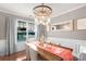 Elegant dining room boasting a stylish chandelier, large window, and a sophisticated table setting for memorable gatherings at 3701 Methodist Church Ln, Waxhaw, NC 28173