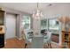 The dining area is illuminated by an elegant chandelier and features direct patio access at 3701 Methodist Church Ln, Waxhaw, NC 28173