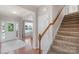The well-lit foyer provides a welcoming entrance with hardwood floors and staircase access at 3701 Methodist Church Ln, Waxhaw, NC 28173