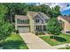 Inviting two-story home featuring a covered front porch, spacious driveway, attached two-car garage, and lush landscaping at 3701 Methodist Church Ln, Waxhaw, NC 28173