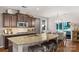 The stunning kitchen features stainless appliances, granite countertops, and a breakfast bar at 3701 Methodist Church Ln, Waxhaw, NC 28173