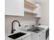 Convenient laundry room featuring granite countertops, modern cabinets, and up-to-date washing machines at 3701 Methodist Church Ln, Waxhaw, NC 28173