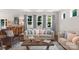 Comfortable living room filled with natural light, featuring stylish sofas, hardwood floors, and a welcoming ambiance at 3701 Methodist Church Ln, Waxhaw, NC 28173