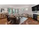 Inviting living room featuring comfortable seating, large windows with natural light, and a cozy fireplace at 3701 Methodist Church Ln, Waxhaw, NC 28173