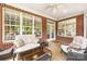 Relaxing back porch with comfortable seating and a view of the lush backyard at 3706 Song Sparrow Dr, Matthews, NC 28104