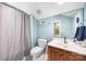 Cozy bathroom with shower, toilet, vanity with sink, and a large mirror for grooming convenience at 3706 Song Sparrow Dr, Matthews, NC 28104