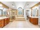 Spacious bathroom with a walk-in shower, double sink vanity, soaking tub, and a private water closet at 3706 Song Sparrow Dr, Matthews, NC 28104
