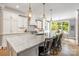 Bright, open kitchen with a large island, quartz countertops, and stainless steel appliances at 3706 Song Sparrow Dr, Matthews, NC 28104