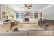 Spacious living room with fireplace, custom built-ins, and lots of natural light at 3706 Song Sparrow Dr, Matthews, NC 28104