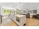 Bright, open floor plan with kitchen, breakfast nook, and living room at 3706 Song Sparrow Dr, Matthews, NC 28104