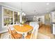 Open concept kitchen and breakfast nook with hardwood floors and lots of light at 3706 Song Sparrow Dr, Matthews, NC 28104