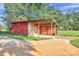 Exterior angle of a large barn featuring enclosed and open sections perfect for outdoor storage at 37156 Southside Rd, Albemarle, NC 28001