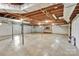 Spacious unfinished basement with exposed ceiling and concrete floors offering potential for customization and storage at 37156 Southside Rd, Albemarle, NC 28001