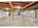 This basement features a doorway to the outside, staircase, and storage at 37156 Southside Rd, Albemarle, NC 28001