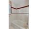 The bathroom has a tub with a shower and tile at 37156 Southside Rd, Albemarle, NC 28001
