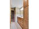 The bathroom features a vanity with a sink, drawers, wallpaper, and tile at 37156 Southside Rd, Albemarle, NC 28001