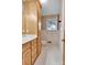 The bathroom features a vanity with a sink, tile, and wallpaper at 37156 Southside Rd, Albemarle, NC 28001