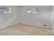 The bedroom features two windows, carpet, and plenty of space at 37156 Southside Rd, Albemarle, NC 28001