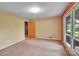 Cozy bedroom featuring neutral walls, carpet, and a double window at 37156 Southside Rd, Albemarle, NC 28001